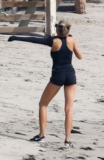 CHARLOTTE MCKINNEY Working Out at a Beach in Malibu 02/28/2016