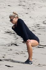 CHARLOTTE MCKINNEY Working Out at a Beach in Malibu 02/28/2016