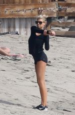 CHARLOTTE MCKINNEY Working Out at a Beach in Malibu 02/28/2016