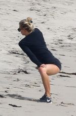 CHARLOTTE MCKINNEY Working Out at a Beach in Malibu 02/28/2016