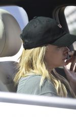 CHLOE MORETZ Chats on Her Phone Near Her Home in Los Angeles 03/22/2016