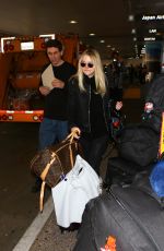 DAKOTA FANNING at LAX Airport in Los Angeles 03/09/2016