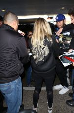 DAKOTA FANNING at LAX Airport in Los Angeles 03/09/2016