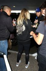 DAKOTA FANNING at LAX Airport in Los Angeles 03/09/2016