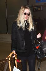 DAKOTA FANNING at LAX Airport in Los Angeles 03/09/2016