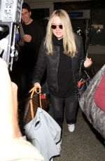DAKOTA FANNING at LAX Airport in Los Angeles 03/09/2016
