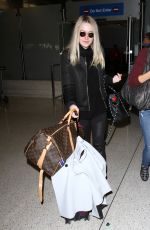 DAKOTA FANNING at LAX Airport in Los Angeles 03/09/2016