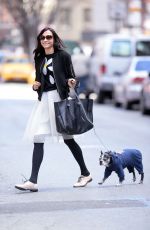 FAMKE JANSEN Walks Her Dog in New York 03/18/2016