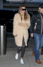 GIGI HADID at JFK Airport in New York 03/18/2016