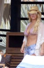 JESSICA SIMPSON in Bikini Top and Daisy Dukes at a Hotel in Cabo San Lucas 03/30/2016
