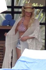 JESSICA SIMPSON in Bikini Top and Daisy Dukes at a Hotel in Cabo San Lucas 03/30/2016