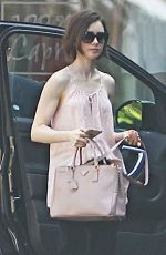 LILY COLLINS Arrives at Peninsula Hotel in Beverly Hills 03/18/2016
