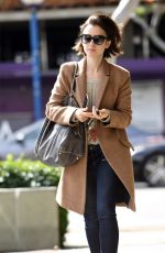 LILY COLLINS Leaves Her Apartment in Los Angeles 03/07/2016