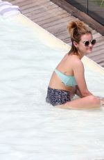 LUCY HALE in Bikini at a Pool at Her Hotel in Brazil 03/07/2016