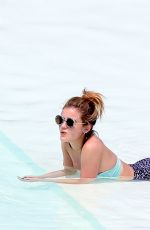 LUCY HALE in Bikini at a Pool at Her Hotel in Brazil 03/07/2016