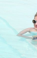 LUCY HALE in Bikini at a Pool at Her Hotel in Brazil 03/07/2016