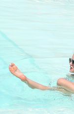 LUCY HALE in Bikini at a Pool at Her Hotel in Brazil 03/07/2016