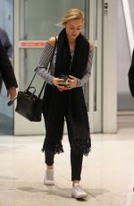 MARGOT ROBBIE Arrives at JFK Airport in New York 03/02/2016