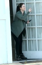MICHELLE TRACHTENBERG Peeks Her Head Out of an Office in Los Angeles 03/14/2016