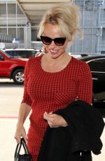 PAMELA ANDERSON Arrives at Los Angeles International Airport 03/24/2016