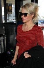 PAMELA ANDERSON Arrives at Los Angeles International Airport 03/24/2016
