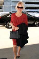 PAMELA ANDERSON Arrives at Los Angeles International Airport 03/24/2016