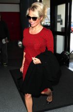 PAMELA ANDERSON Arrives at Los Angeles International Airport 03/24/2016