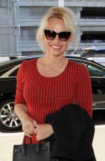 PAMELA ANDERSON Arrives at Los Angeles International Airport 03/24/2016