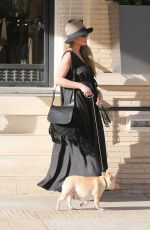 Pregnant CHRISSY TEIGEN Walks Her Dog Out in Beverly Hills 03/14/2016