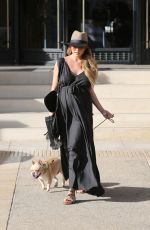 Pregnant CHRISSY TEIGEN Walks Her Dog Out in Beverly Hills 03/14/2016