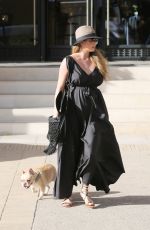 Pregnant CHRISSY TEIGEN Walks Her Dog Out in Beverly Hills 03/14/2016