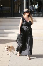 Pregnant CHRISSY TEIGEN Walks Her Dog Out in Beverly Hills 03/14/2016