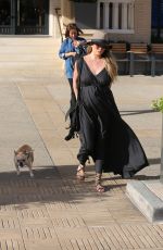 Pregnant CHRISSY TEIGEN Walks Her Dog Out in Beverly Hills 03/14/2016