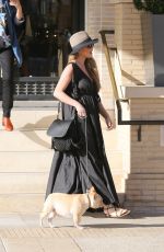 Pregnant CHRISSY TEIGEN Walks Her Dog Out in Beverly Hills 03/14/2016