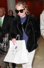 ASHLEY BENSON at LAX Airport in Los Angeles 04/08/2016
