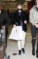 ASHLEY BENSON at LAX Airport in Los Angeles 04/08/2016