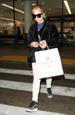 ASHLEY BENSON at LAX Airport in Los Angeles 04/08/2016