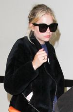 ASHLEY BENSON at LAX Airport in Los Angeles 04/08/2016