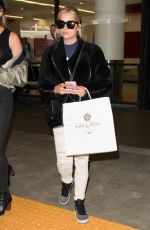 ASHLEY BENSON at LAX Airport in Los Angeles 04/08/2016