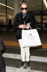 ASHLEY BENSON at LAX Airport in Los Angeles 04/08/2016