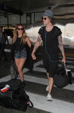 ASHLEY TISDALE at Los Angeles International Airport 04/25/2016