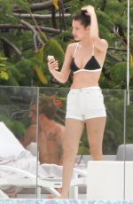 BELLA HADID in Bikini Top at a Pool in St. Barts 04/01/2016