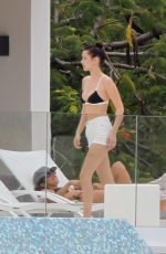 BELLA HADID in Bikini Top at a Pool in St. Barts 04/01/2016