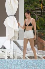 BELLA HADID in Bikini Top at a Pool in St. Barts 04/01/2016
