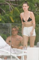 BELLA HADID in Bikini Top at a Pool in St. Barts 04/01/2016