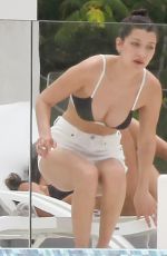BELLA HADID in Bikini Top at a Pool in St. Barts 04/01/2016