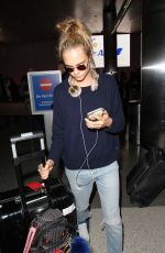 CARA DELEVINGNE at LAX Airport in Los Angeles 04/08/2016