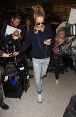 CARA DELEVINGNE at LAX Airport in Los Angeles 04/08/2016