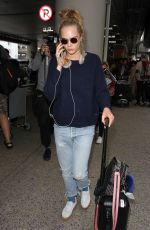 CARA DELEVINGNE at LAX Airport in Los Angeles 04/08/2016