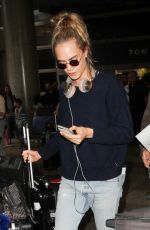 CARA DELEVINGNE at LAX Airport in Los Angeles 04/08/2016